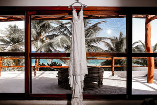Bride and groom on the villa staircase, Tulum wedding