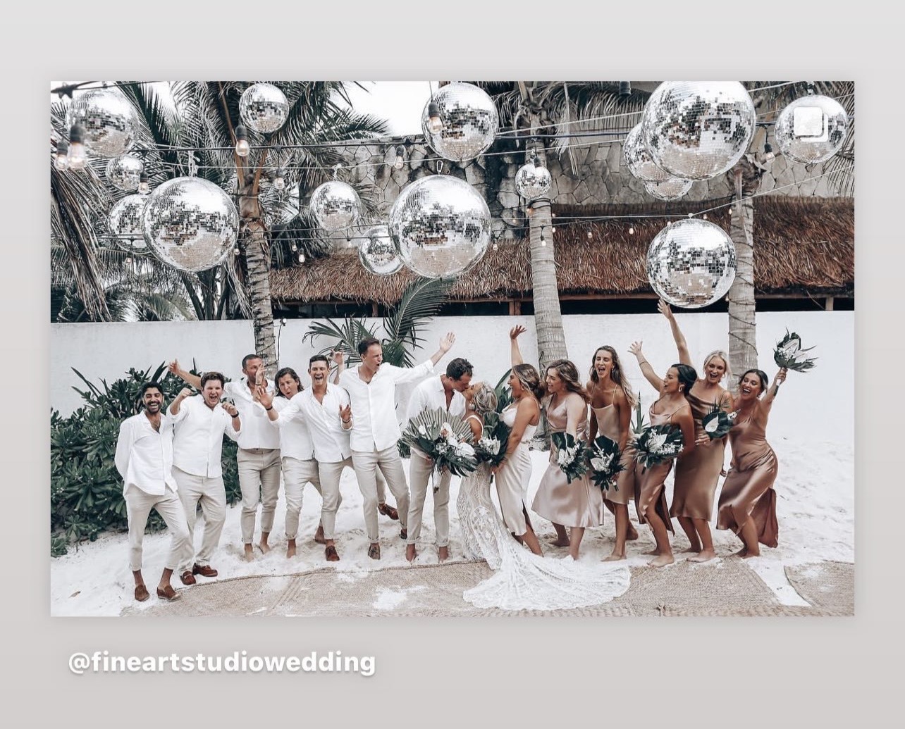 Wedding party celebrating under disco balls at Casa Carolina Tulum
